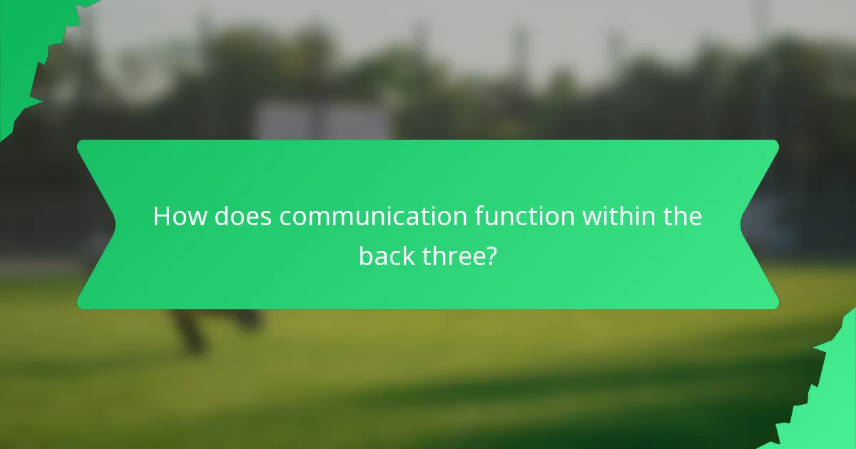 How does communication function within the back three?